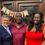 Aled Jones standing next to Eddie and Estelle at their home in London.
