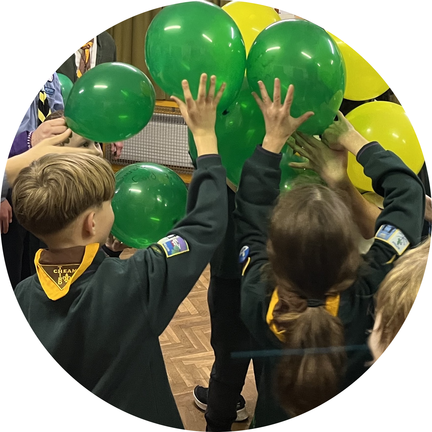 Scouts with green and yellow balloons