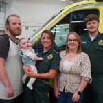 A group photo of Dad Michael, Courtney holding baby Lydia, mum Abie, Corey