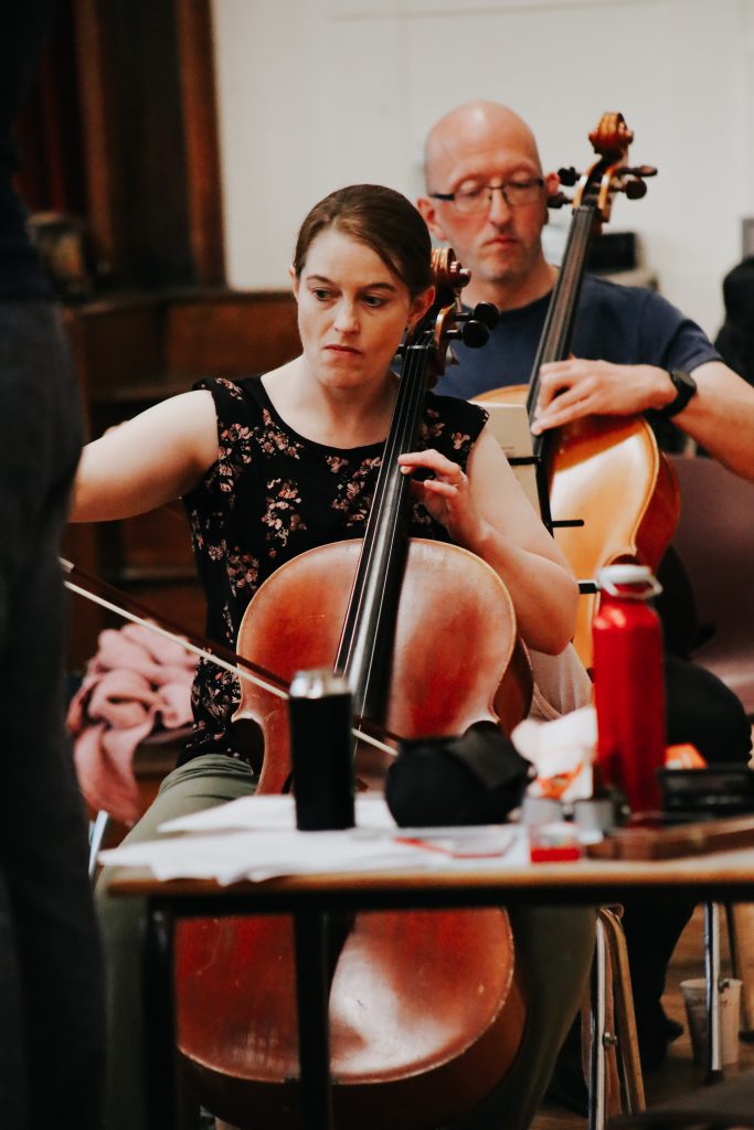 London Ambulance Service Paramedic Heather Cole playing the cello with the Blue Light Symphony Orchestra