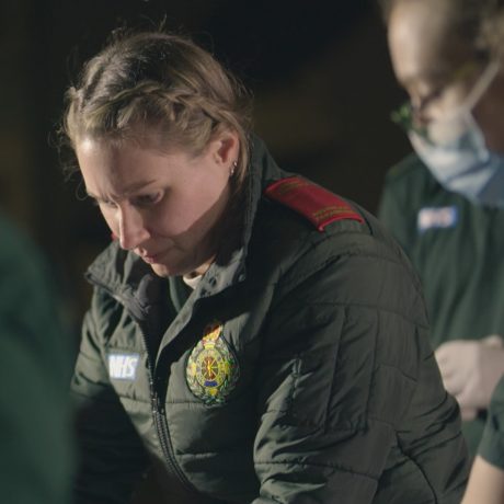 Nikki treating a patient on-scene in BBC Ambulance, working alongside London's Air Ambulance.