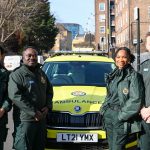 A photo of four mental health specialist clinicians standing by a fast-response car.